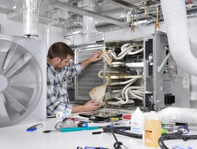 North Reading Air Duct Cleaning specialist performing precision AC coil cleaning in North Reading
