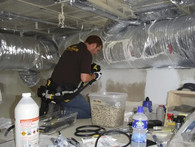 North Reading Air Duct Cleaning specialist performing professional mold removal from air ducts in North Reading