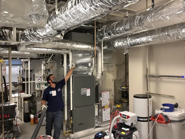 North Reading Air Duct Cleaning specialist performing thorough furnace duct cleaning in a North Reading residence