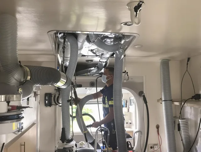 North Reading Air Duct Cleaning specialist performing precise mobile home duct cleaning in North Reading